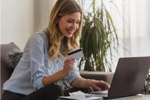 Woman with a credit card and laptop